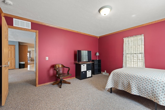 bedroom featuring crown molding, carpet, and a textured ceiling