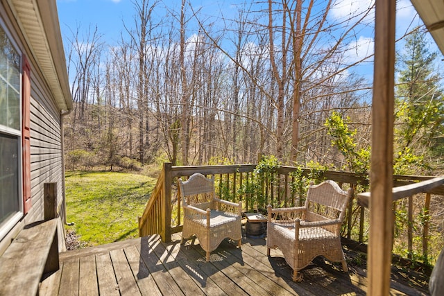 wooden deck with a lawn