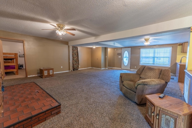 179 Bill Patrick Rd, Whitley City, KY 42653 - carpeted living room with a ceiling fan, a textured ceiling, and baseboards