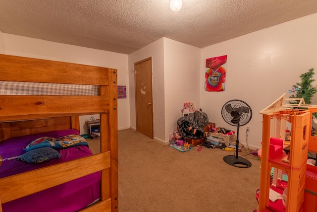 carpeted bedroom featuring a textured ceiling