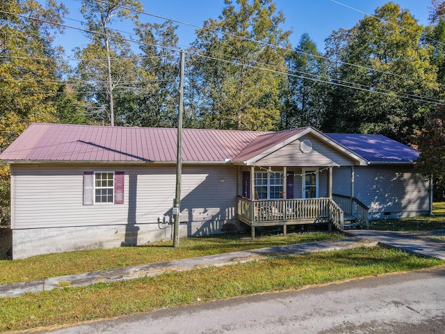 179 Bill Patrick Rd, Whitley City, KY 42653 - single story home featuring covered porch, metal roof, crawl space, and a front lawn