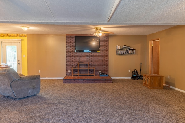 carpeted living room with ceiling fan and a textured ceiling