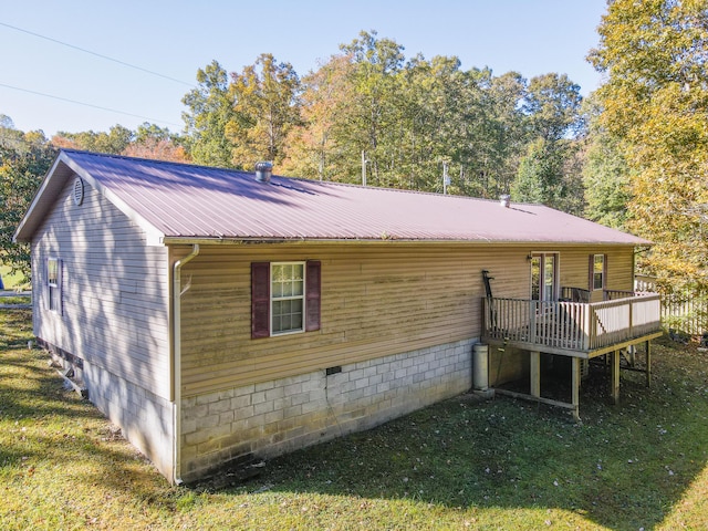 179 Bill Patrick Rd, Whitley City, KY 42653 - rear view of property with a wooden deck, metal roof, crawl space, and a lawn