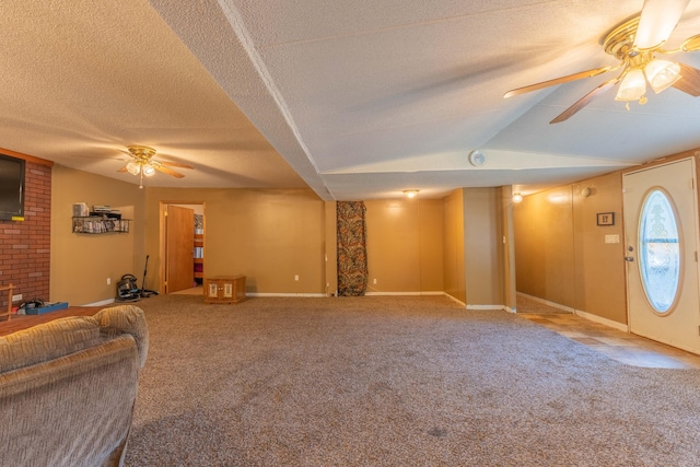 carpeted living room featuring ceiling fan, a textured ceiling, and lofted ceiling