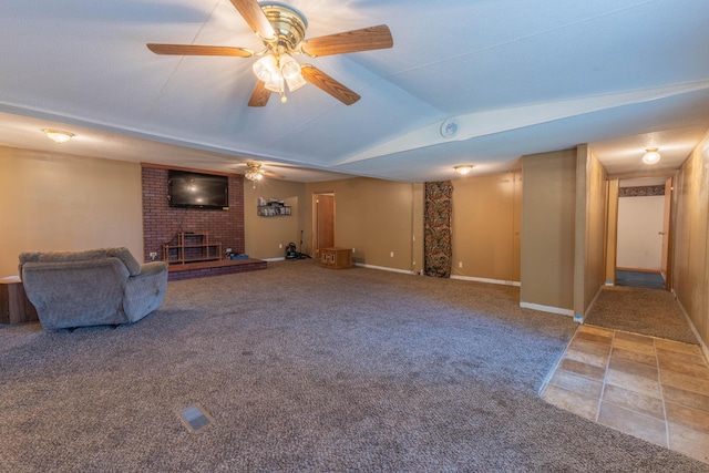 179 Bill Patrick Rd, Whitley City, KY 42653 - unfurnished living room with a fireplace, vaulted ceiling, carpet flooring, a ceiling fan, and baseboards