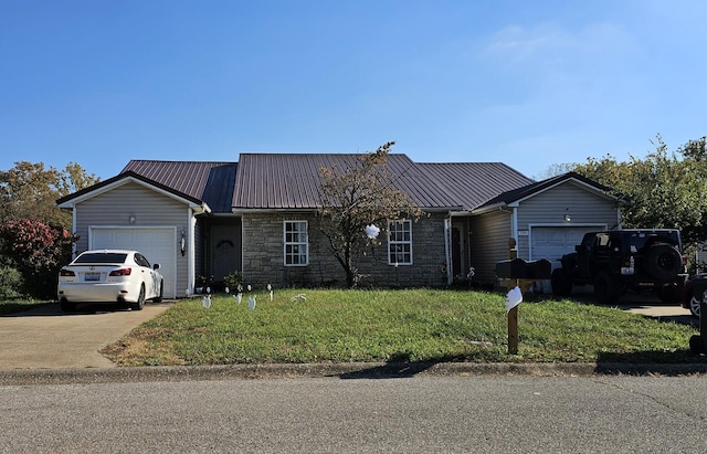 ranch-style home with a garage and a front lawn