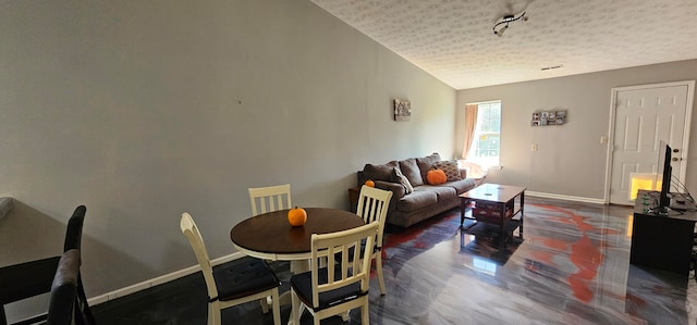 dining area with lofted ceiling, a textured ceiling, and dark hardwood / wood-style flooring