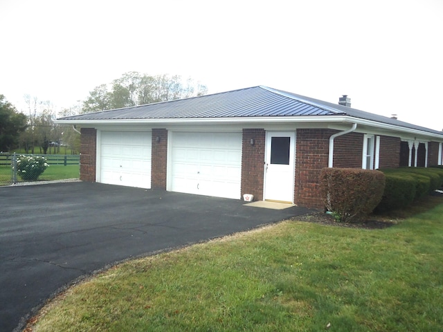 garage with a lawn