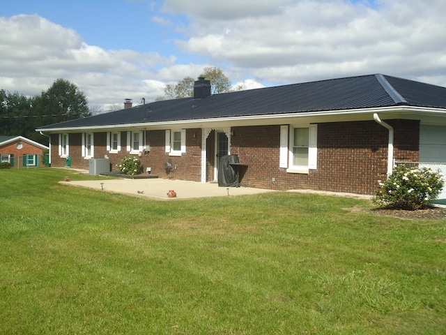 back of house with a yard, a patio, and central AC unit