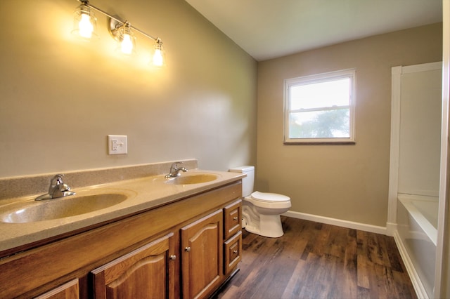 full bathroom with wood-type flooring, vanity, toilet, and shower with separate bathtub