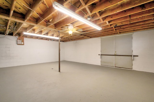 basement with ceiling fan