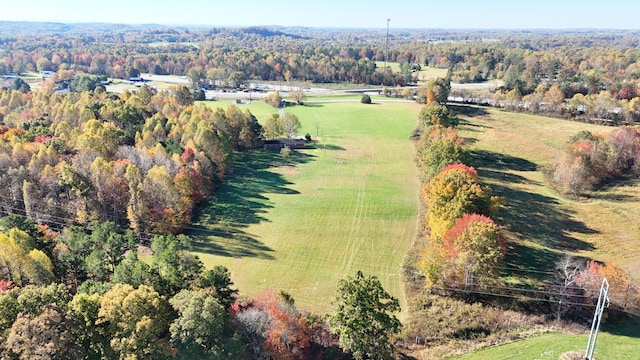 birds eye view of property with a rural view