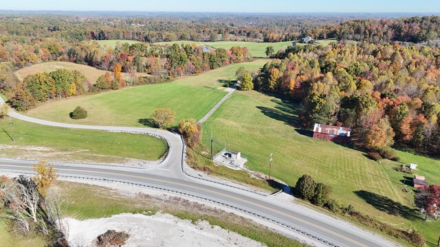 birds eye view of property with a rural view