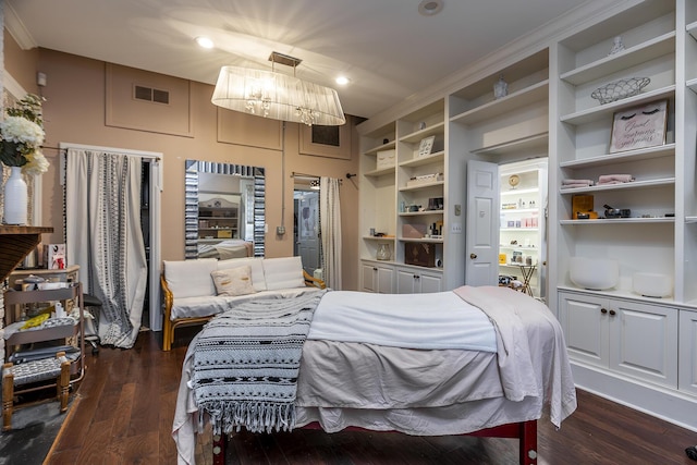 302 W High St, Lexington, KY 40507 - bedroom with dark wood-type flooring, recessed lighting, and a chandelier