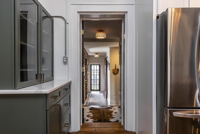 302 W High St, Lexington, KY 40507 - kitchen with freestanding refrigerator, gray cabinetry, dark wood-type flooring, and glass insert cabinets