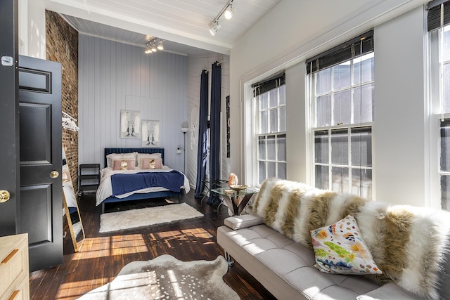 302 W High St, Lexington, KY 40507 - bedroom with wood-type flooring, wooden walls, and track lighting