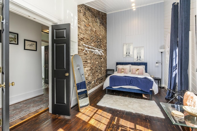 302 W High St, Lexington, KY 40507 - bedroom with hardwood / wood-style flooring, baseboards, and brick wall