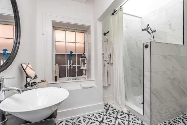 302 W High St, Lexington, KY 40507 - full bathroom with tiled shower, a sink, tile patterned floors, and baseboards