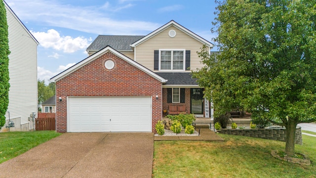 view of front of house featuring a garage, a front lawn, and a porch