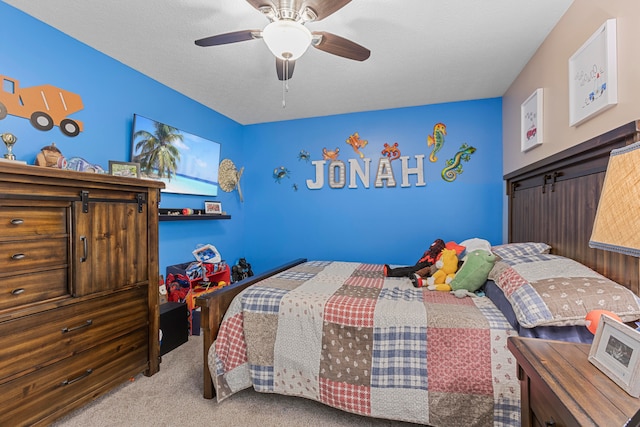 bedroom featuring light colored carpet and ceiling fan