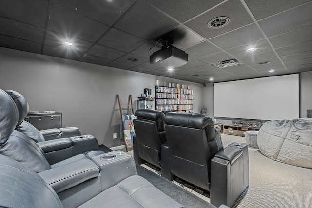 cinema room featuring a paneled ceiling and carpet flooring