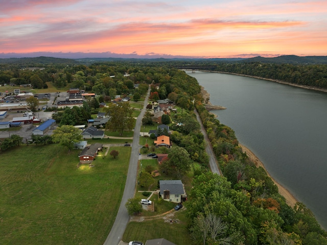 aerial view at dusk with a water view