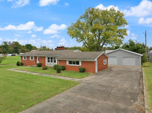 ranch-style house with an outbuilding, a front lawn, and a garage