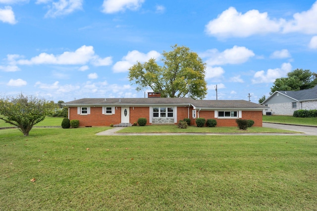 ranch-style home with a front yard