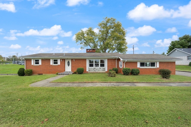 ranch-style house featuring a front lawn