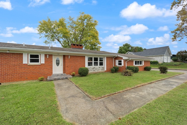 ranch-style home featuring a front yard