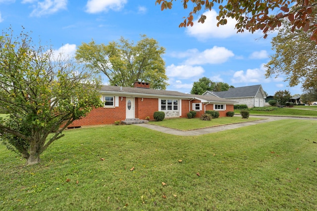 ranch-style house featuring a front lawn