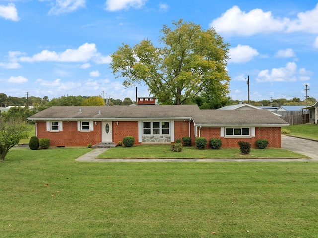 ranch-style house with a front lawn