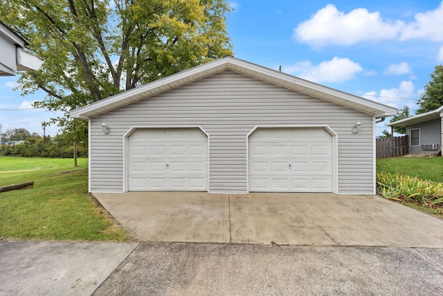 garage featuring a yard