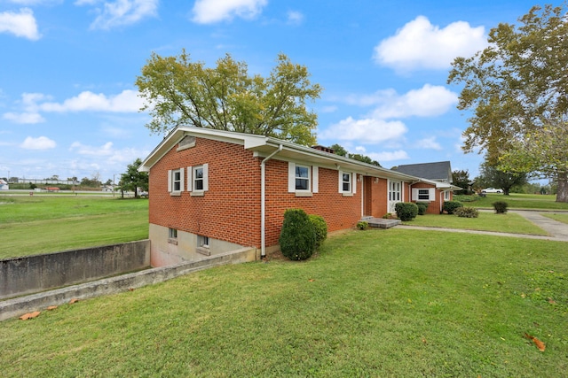 ranch-style house with a front lawn