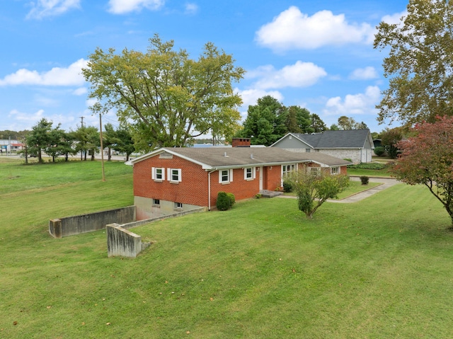 back of property featuring a lawn