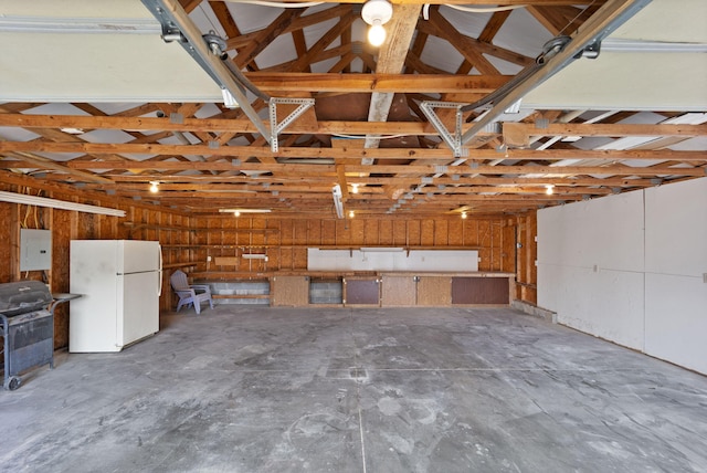 garage featuring white fridge