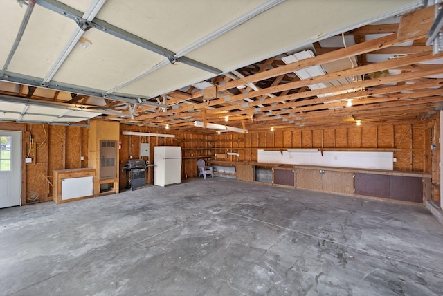 garage with white refrigerator