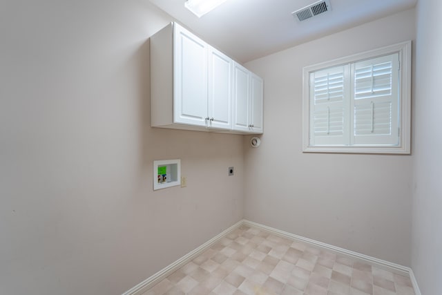 laundry room with hookup for a washing machine, electric dryer hookup, and cabinets