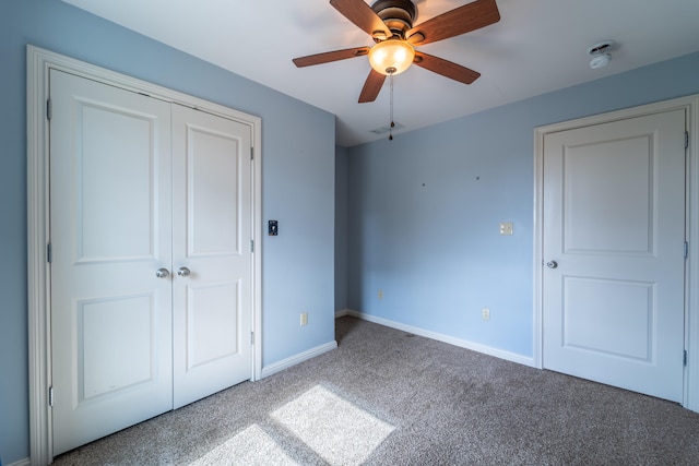 unfurnished bedroom featuring a closet, ceiling fan, and carpet flooring