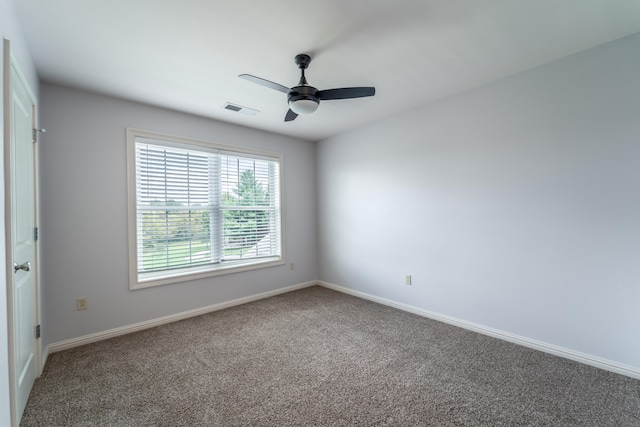 carpeted empty room with ceiling fan