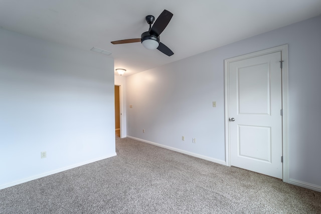 carpeted empty room with ceiling fan