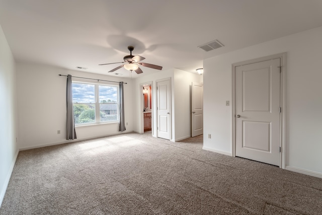 unfurnished bedroom with light carpet and ceiling fan