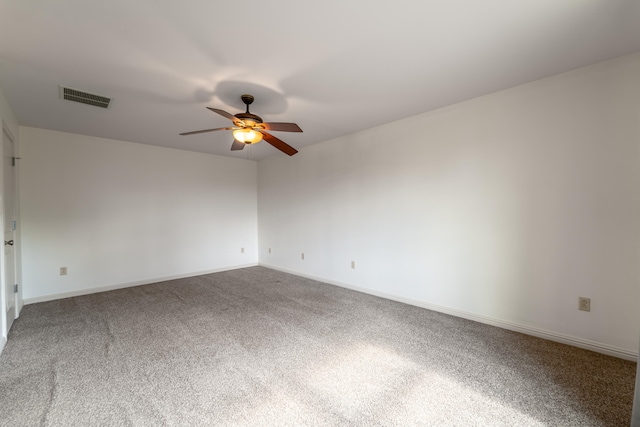 unfurnished room with carpet flooring and ceiling fan