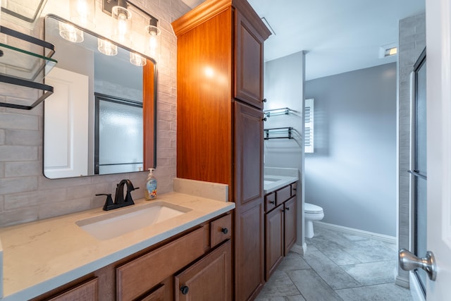 bathroom featuring toilet, an enclosed shower, tasteful backsplash, and vanity