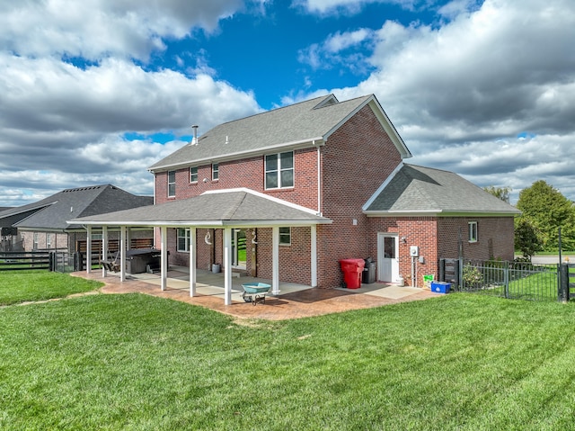 back of property featuring a patio and a lawn