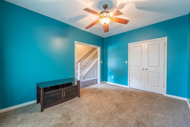 bedroom featuring carpet, a closet, and ceiling fan