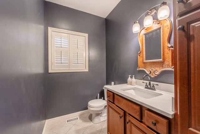 bathroom featuring vanity, toilet, and tile patterned floors