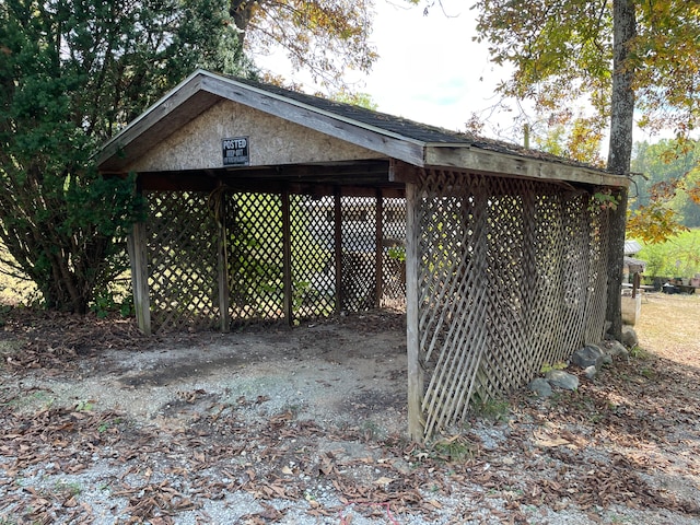 view of outbuilding featuring a carport