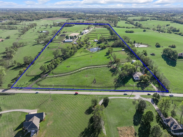 birds eye view of property featuring a rural view