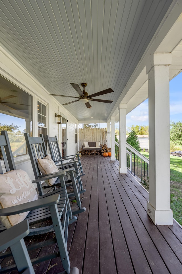 wooden deck with ceiling fan and a porch